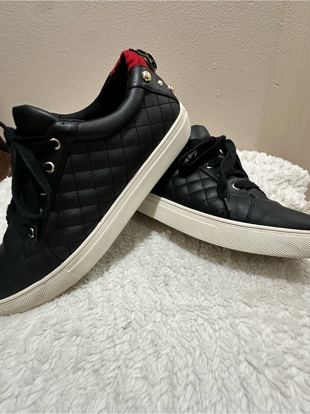 Kurt Geiger woman’s Black Quilted Low-Top Sneakers with White Sole